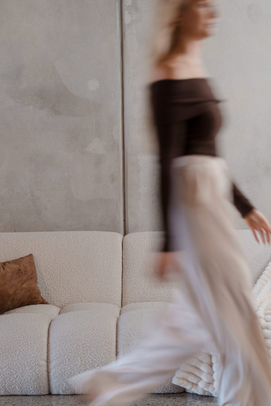 Editorial motion shot in the Gravitate Studio lounge, movement, calm, premium space